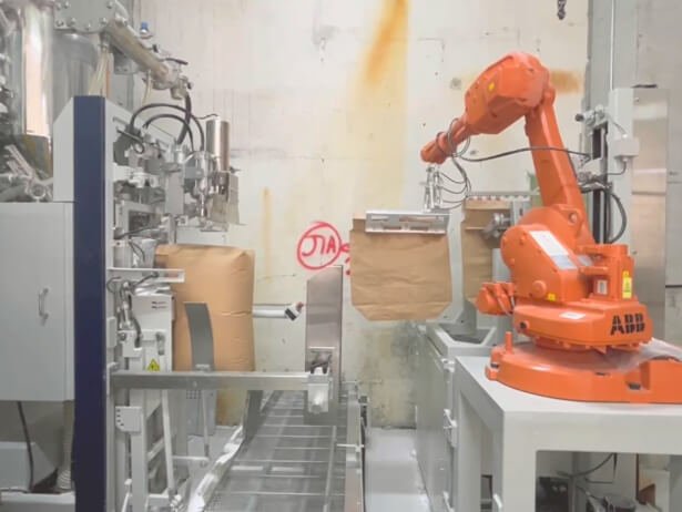 Air type filler with automatic robot bag placer - small